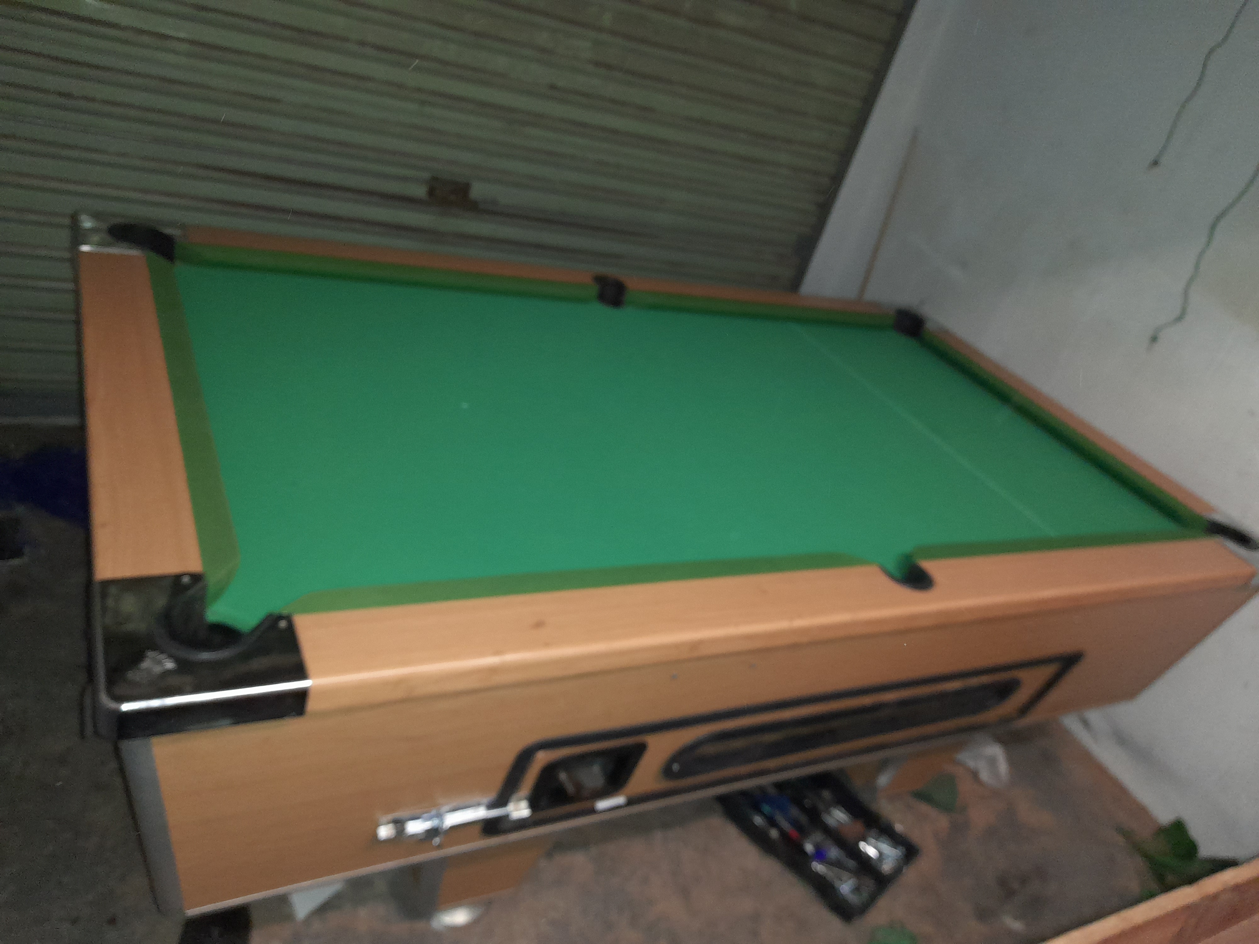 Coin operated billiards